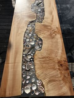 a wooden table topped with lots of buttons