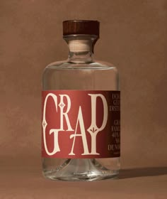 a bottle of grad gin on a brown background