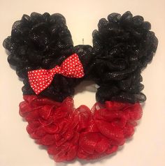 two black and red hair bows with polka dots