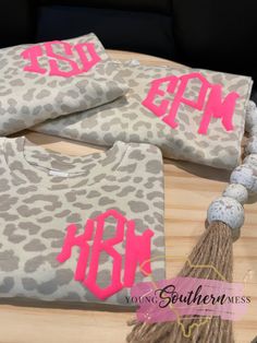 This natural leopard print shirt is unisex in fit and is super soft! The monogram is made with puff vinyl. Available in children's-adult sizes. They would be so cute for family matches! Infant sizes come in ONESIES only, no t-shirt. Shirts are LAT brand. We use a professional heat press and high quality vinyl.  Leave monogram in the exact order you want it to appear. firstLASTmiddle initial order Monogram will be made exactly as you enter it, so please double check this for accuracy. Message me Leopard Print Shirts, Monogram Shirts For Women, Puff Vinyl Shirt Ideas Fall, Monogram Shirt Ideas, Animal Print Vinyl Shirt Ideas, Initial Shirts Vinyl Ideas, Cute Cricut Shirts For Women, Custom T Shirts Design, Puff Print Design