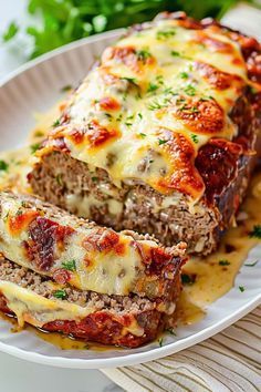 meatloaf with cheese and sauce on a plate