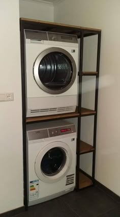 there is a washer and dryer in the room next to eachother