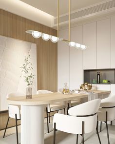 a dining room with white chairs and a table