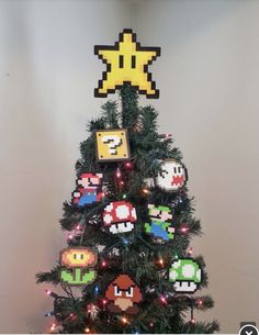 a christmas tree decorated with video game ornaments