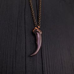 Discover the wild beauty of the Arctic with this stunning Large Arctic Wolf Claw Pendant. Cast from a perfect real claw using the traditional lost wax hot cast bronze method, this piece showcases exceptional detail and craftsmanship. Measuring 1-3/4" around the curve, the claw has been polished to a bright finish and then skillfully oxidized to achieve a unique, old tarnished appearance. This pendant is more than just a piece of jewelry; it's a tribute to the majestic Arctic wolf and a perfect g Arctic Wolf, Claw Necklace, State Necklace, Wolf Jewelry, Fire Opal Necklace, Silver Wolf, Purple Jade, Unisex Necklace, Skull Necklace