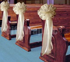 wooden pews decorated with bows and ribbons