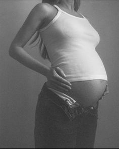 black and white photograph of a pregnant woman