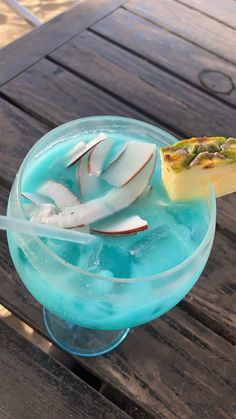 a blue drink sitting on top of a wooden table