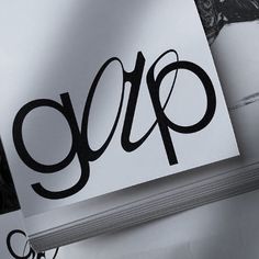 an open book with the word gap written in black ink on it next to a pair of scissors