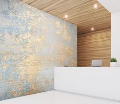 a white counter in front of a wall with gold and blue paint on the walls