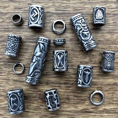 A wide selection of stainless steel dreadlock beads. Dread Accessories, Beard Beads, Dreadlock Jewelry, Dreadlock Beads, Viking Hair, Bracelets Handmade Diy, Dread Beads, Celtic Patterns, Viking Runes