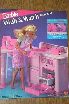 the barbie doll is washing dishes in the kitchen