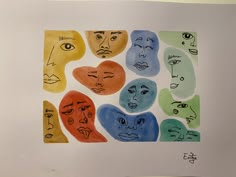 a drawing of many faces with different colors and shapes on them, all drawn by hand