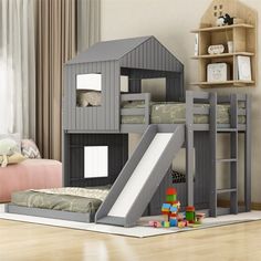 a child's bedroom with a loft bed and slide