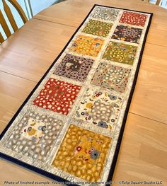 the table runner is made from patchwork squares