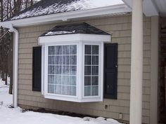 a house that has snow on the ground