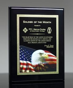 an american flag and bald eagle on a black plaque with the words soldier of the month