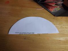 a piece of paper on top of a wooden table