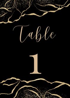 a black and gold table number card with the number one on it's side