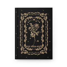 a black book with gold foil lettering and a rose in the middle, surrounded by stars