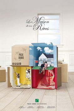 several boxes stacked on top of each other in front of a window with the words la maison de renes