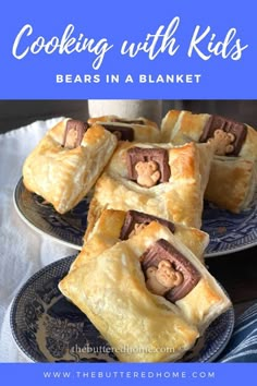 some cookies with kids bears in a blanket on a plate