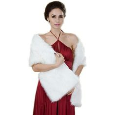 a woman in a red dress is holding a white fur shawl over her shoulder