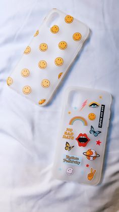 two phone cases with smiley faces on them