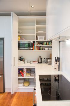 the kitchen is clean and ready to be used for cooking, baking, and eating