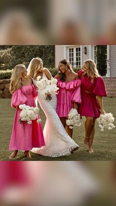 three bridesmaids in bright pink dresses are standing together and holding white bouquets