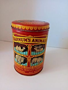 an old tin canister with the label barnum's animals on it