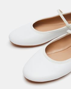 CLASSIC + EASY + CLEAN BOUQUET is the quintessential low profile and lightweight ballet flat design with a slim elastic strap over the top for a secure and comfortable fit. Ballet flat Slip-on style with top elastic strap .5 inch heel height Leather and textile upper material Vegan leather lining Vegan leather sock Synthetic sole Imported Ankle Strap Ballet Flats For Spring, Fitted Ballet Flats With Ankle Strap For Spring, Spring Ballet Flats With Ankle Strap And Removable Insole, Spring Ankle Strap Ballet Flats With Removable Insole, Classic Ankle Strap Flats For Spring, Spring Ballet Flats With Heel Strap, White Ballet Flats For Everyday Spring Use, Everyday Ballet Flats With Low Heel And Medium Width, Everyday Ballet Flats With Low Heel, Medium Width