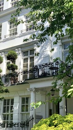 an apartment building with balconies and windows