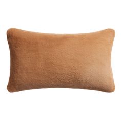 a brown pillow on a white background