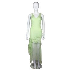 John Galliano silk dress in mint green, from the Fall/Winter 1995 'Delores' collection, a tribute to the Mexican actress Dolores del Rio. As seen on the runway. The dress features beautifully constructed ruffles of silk chiffon and a draped chain on the back. Condition Good. Due to the age and delicate nature of the fabric there are some minor flaws, 2 of the seams have slight wear. A couple of very faint marks only visible upon close inspection. The charm on the back has possibly been re attach Dior John Galliano Dress, Dior Vintage Dress John Galliano, Moda2000 Green Dress, John Galliano White Dress, John Galliano Wedding Dress, Galliano Wedding Dress, Vintage Galliano, Vintage Dior Dress, Galliano Dress