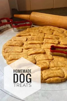 homemade dog treats on a table with rolling dough