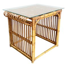 a table made out of bamboo with glass top