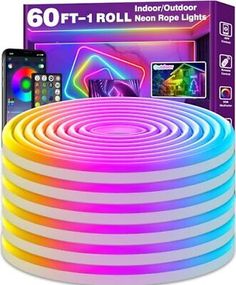 an image of a rainbow colored light up tube with remotes and phone in the background