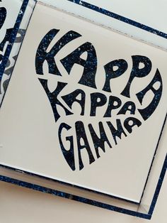 two greeting cards with the words happy game written in black on white paper and blue speckles