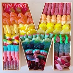 a box filled with lots of different colored candies