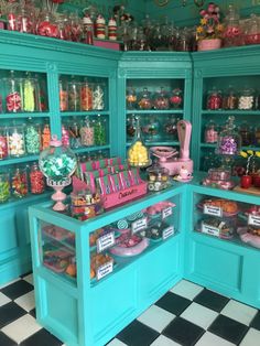 a room filled with lots of different types of candy and candies on top of shelves