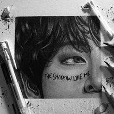 a black and white photo with the words the shadow like me written on it next to some crayons