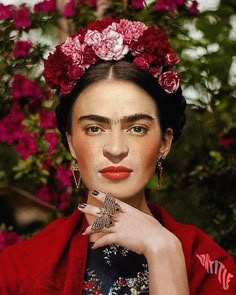 an image of a woman with flowers in her hair wearing a red kimono and ring