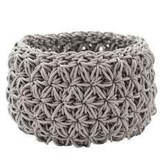 a close up of a woven bracelet on a white background with no people around it