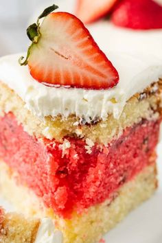 a piece of cake with strawberries on top