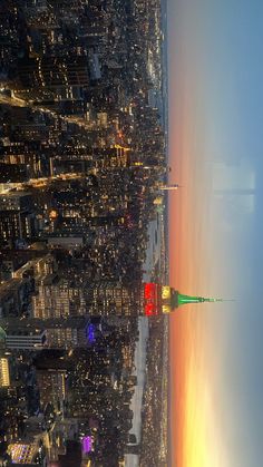 an aerial view of the city lights and skyscrapers in new york city at night