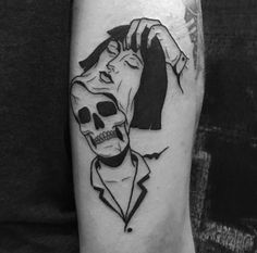 a person with a skull on their arm