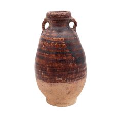 a brown and black vase with handles on white background