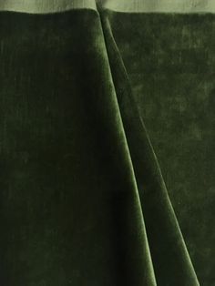 a close up view of a green velvet material