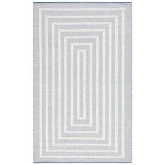 a rug with white and blue stripes on the bottom, in front of a white background